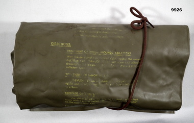 Medical kit with tablets and bandages.