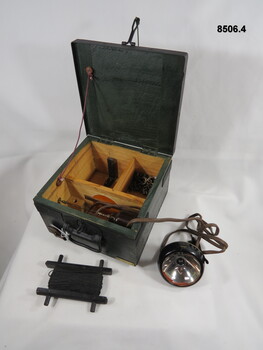 Machine Gun aiming lamp in wooden box.