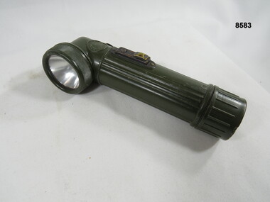 Hand held lamp with webbing attachments.