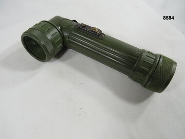 Hand held lamp with webbing attachment.