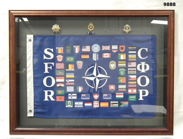 Wooden framed banner and badges.