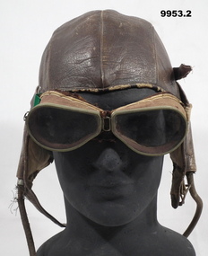 Leather flying helmet with goggles from Korean War.