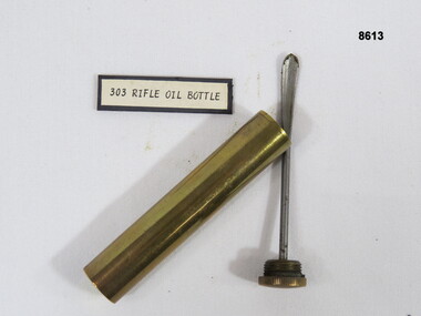 Brass oil bottle with insert.