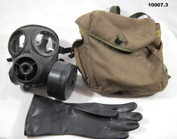 Full face gas mask with bag and glove.