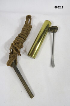 Rifle pull through and Brass oil container.
