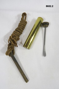 Rifle pull through and Brass oil container.