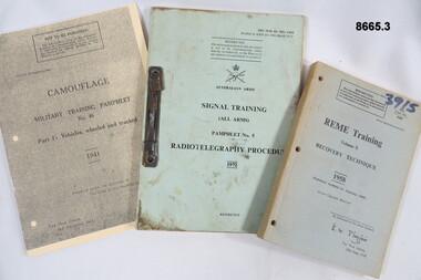 Three training manuals, REME Recovery, Signal Training and Vehicle Camouflage.