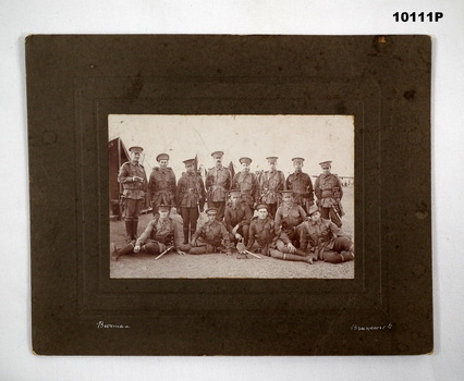 Group of Army soldiers, sepia photograph.