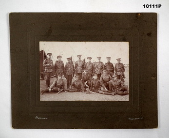 Group of Army soldiers, sepia photograph.