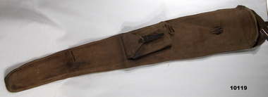 Brown canvas rifle bag with pocket.
