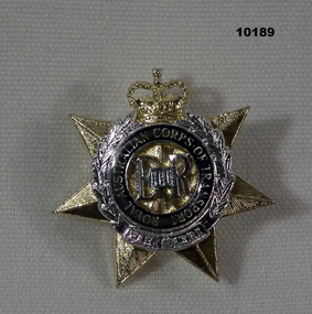 RACT gold and silver coloured officer's collar badge.