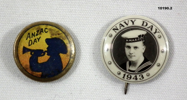 Two round commemorative badges - ANZAC Day and Navy Day.