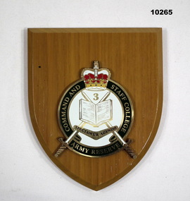 Shield shaped plaque with Command and Staff College insignia.