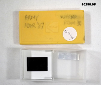 Plastic box containing seven (7) colour slides featuring the Army.