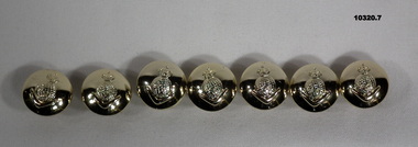 Collection of seven Army uniform buttons.