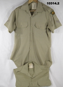 Khaki Army uniform, short sleeved dress shirts.