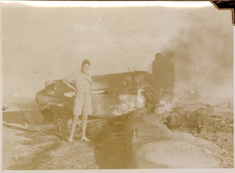 Groundcrew with crashed P40 Western Desert.                            