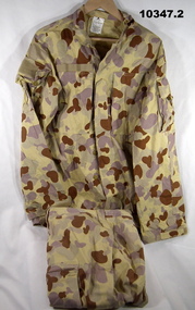 Jacket and trousers in desert pattern camouflage.