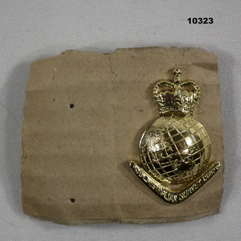 Army Uniform, gold coloured lapel badge.