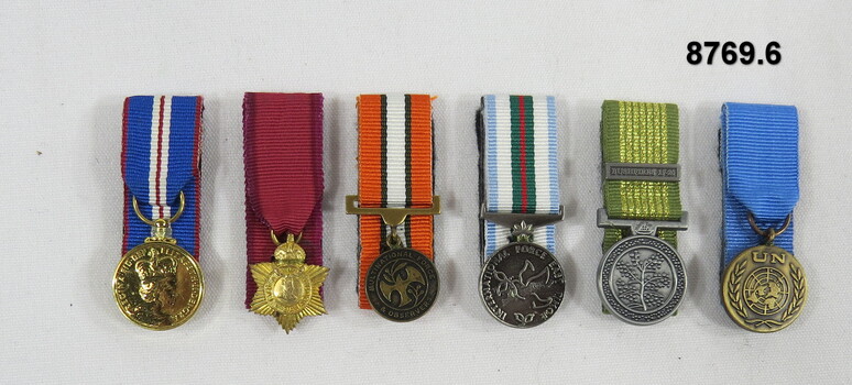 Set of six (6) miniature medals.