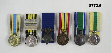 Set of six (6) miniature medals.