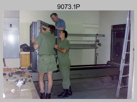 Litho Technicians Dismantling the Consolidation Camera, Army Survey Regiment, Fortuna, Bendigo. 1989.