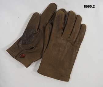 Left and right hand leather riding gloves.