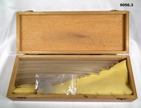 Wooden box containing the set of plastic railway curves