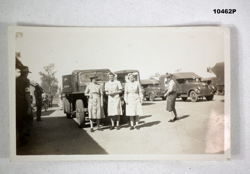 Black and white photograph of three army nurses.