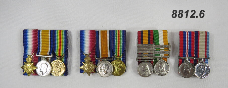 Set of four (4) mounted miniature medals.