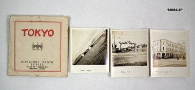 Envelope containing three photographs of Tokyo vistas.