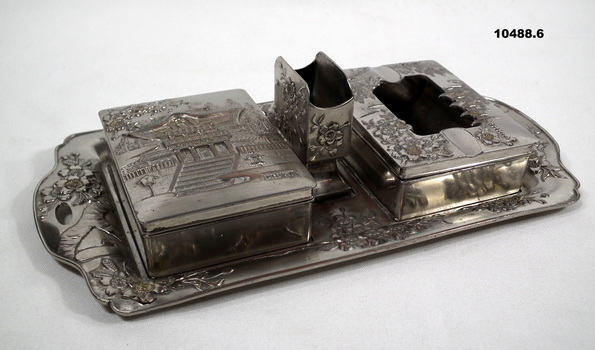 Six piece pewter smoking set.