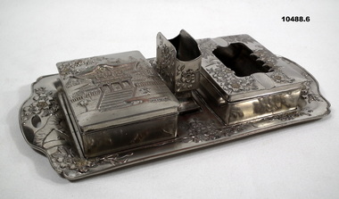 Six piece pewter smoking set.