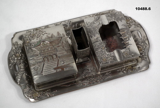Six piece pewter smoking set.
