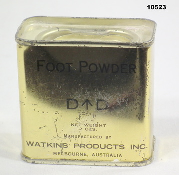 Gold coloured tin of foot powder.