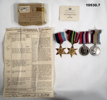 Medal set with accompanying items.