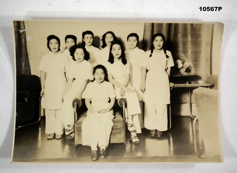 Group photograph of Japanese women in white uniforms.