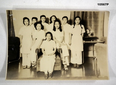 Group photograph of Japanese women in white uniforms.