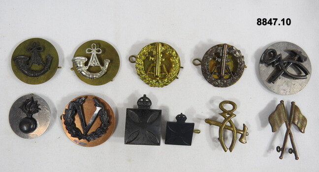 Various Military badges of different styles.