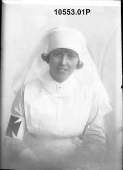 10553.01P Miss A Henry, wearing the uniform of a nursing orderly of the Voluntary Aid Detachment                                               