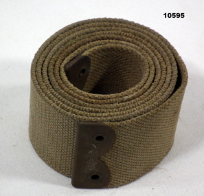 Webbing strap, Kahki colour with brass ends.