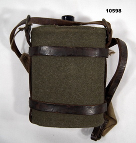 Water bottle with green cloth cover and carry strap.