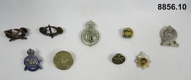 Various military badges of different types.