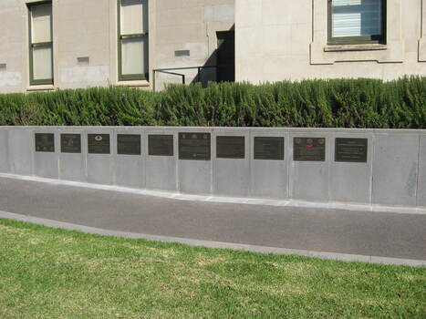 Ten plaques up on the Memorial walls,