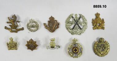 Various Military badges of different types.