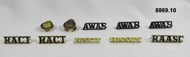 Various military badges of different types.