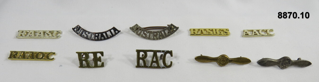 Various military badges of different types.