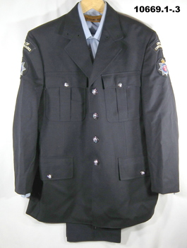 Uniform  - black jacket, trousers, shirt and cap.