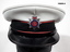 Uniform black jacket, trousers, shirt and cap.
