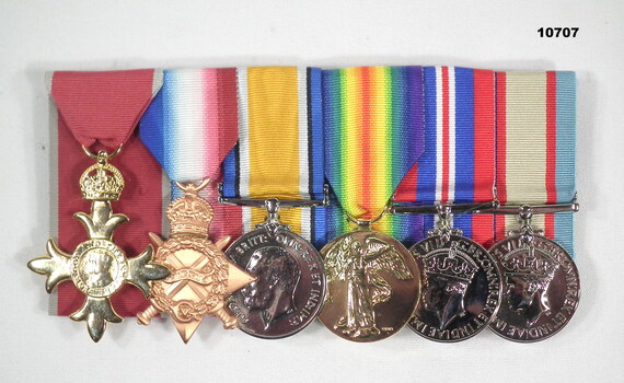 WW1 and WW2 medals with an OBE.